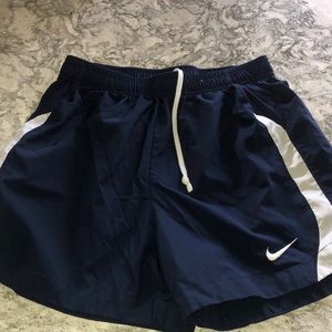Navy nylon running shorts with liner